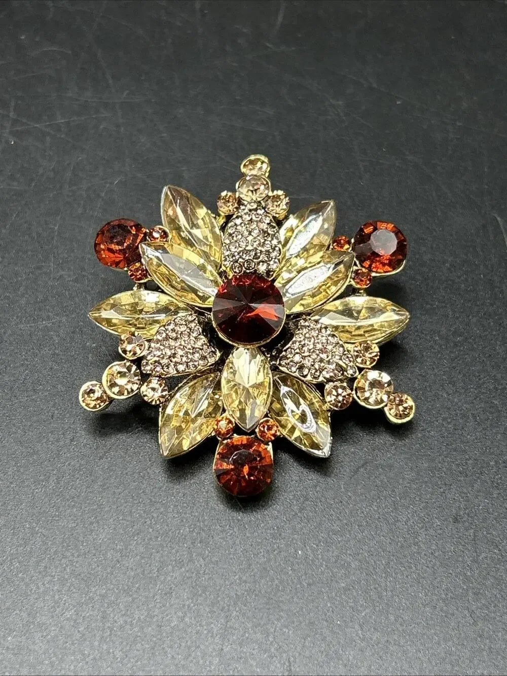 Modern Flower Starburst Pin Brooch Gold tone 1 3/4” Long Amber Color Rhinestones